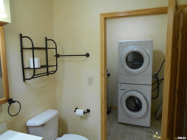 537 N Washington St, Bushnell, IL 61422 - bathroom featuring toilet and estacked washer and dryer