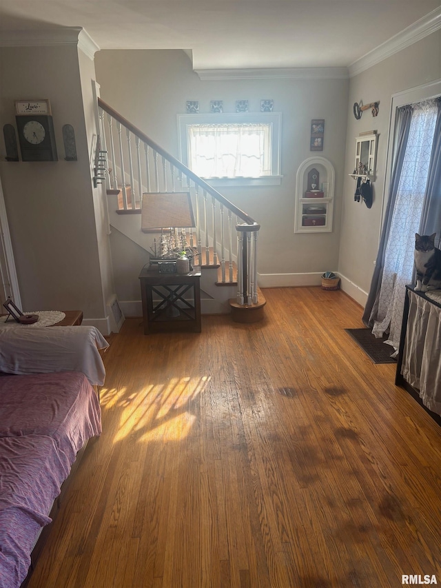 living room featuring crown molding and hardwood / wood-style floors