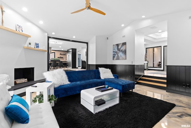 living room featuring a wainscoted wall and recessed lighting