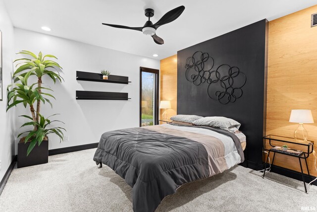 bedroom with an accent wall, recessed lighting, light carpet, and ceiling fan