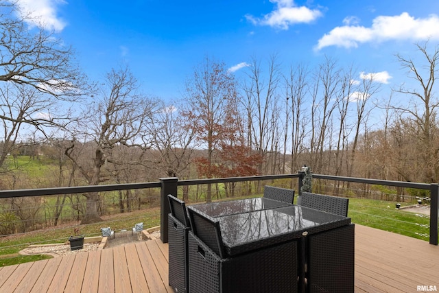 wooden deck featuring outdoor dining space