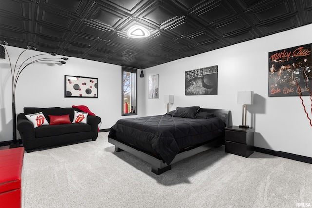 carpeted bedroom with an ornate ceiling and baseboards