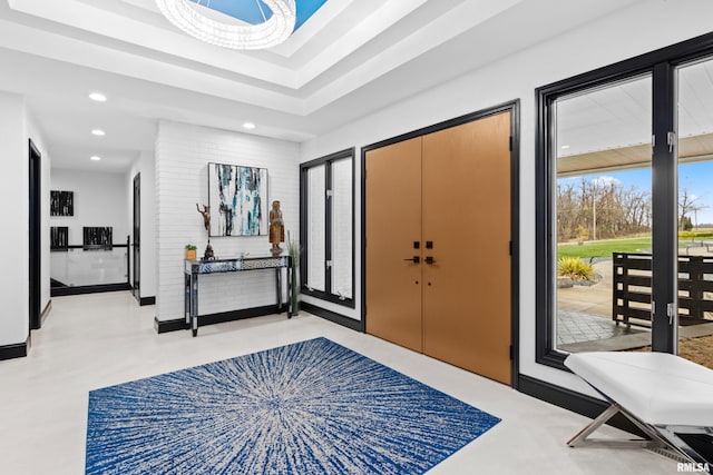 entrance foyer featuring baseboards and recessed lighting