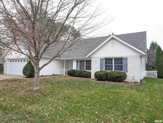 ranch-style home with a front lawn and a garage