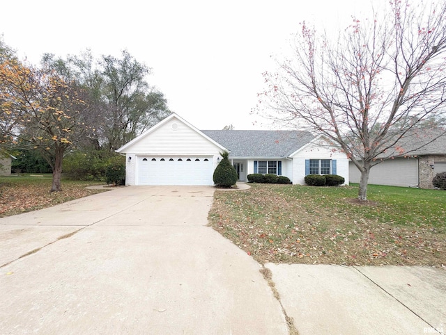 single story home with a garage and a front lawn