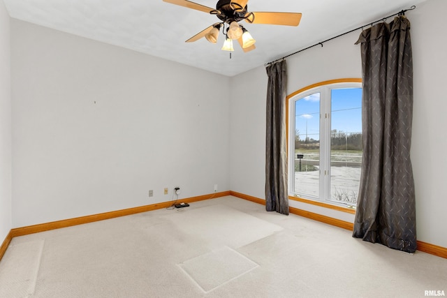 carpeted empty room with ceiling fan