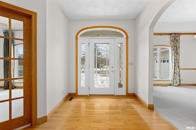 foyer with plenty of natural light and light wood-type flooring