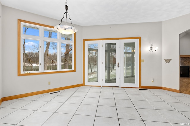 empty room with light tile patterned floors