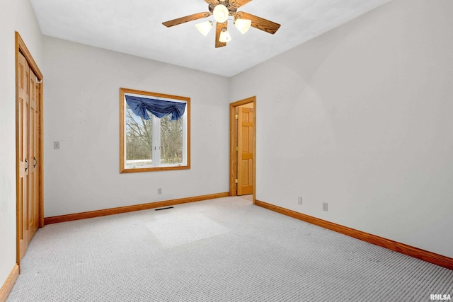 unfurnished bedroom with light carpet and ceiling fan