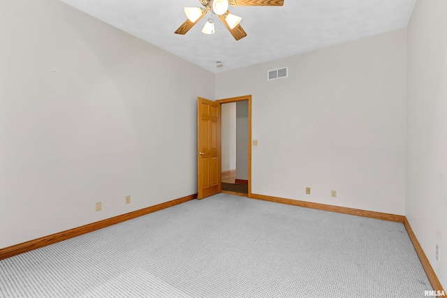 carpeted empty room with ceiling fan