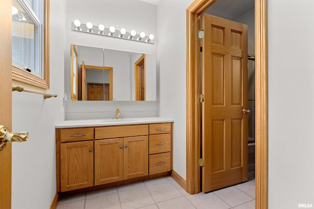 bathroom featuring tile patterned flooring and vanity