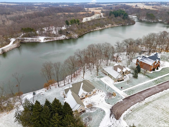 snowy aerial view featuring a water view