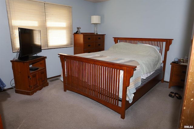 bedroom with light colored carpet