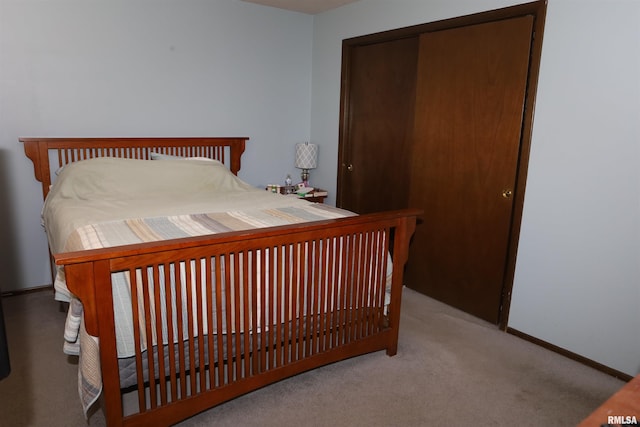 carpeted bedroom with a closet