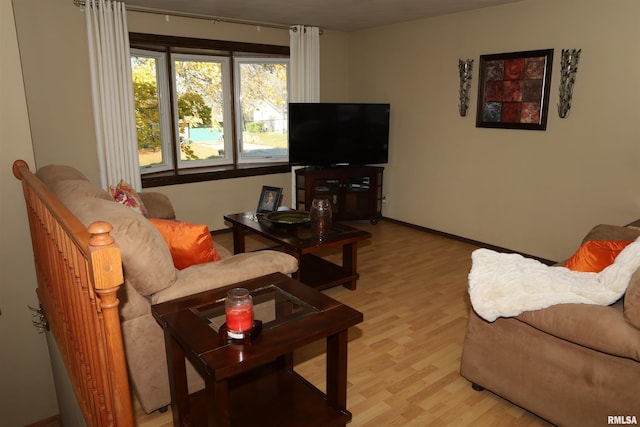 living room with light hardwood / wood-style flooring