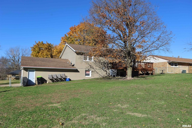 exterior space featuring a lawn and a wooden deck