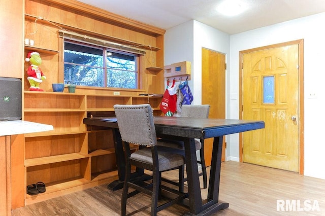 dining area with hardwood / wood-style flooring