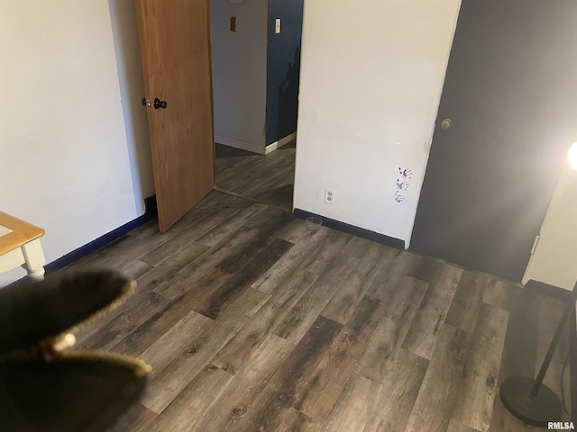 spare room featuring dark hardwood / wood-style flooring