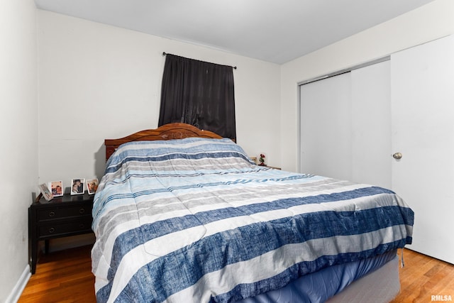 bedroom featuring a closet and hardwood / wood-style flooring