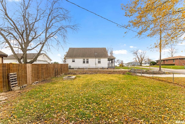 back of house featuring a yard