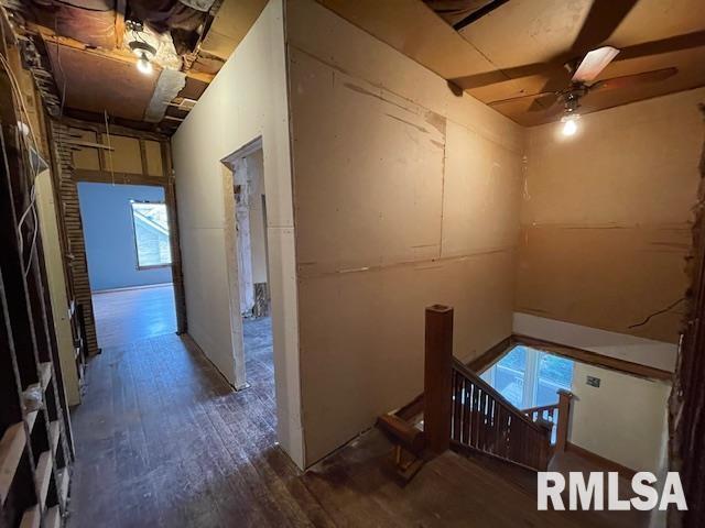 704 S Lafayette St, Macomb, IL 61455 - hall with wood finished floors and an upstairs landing