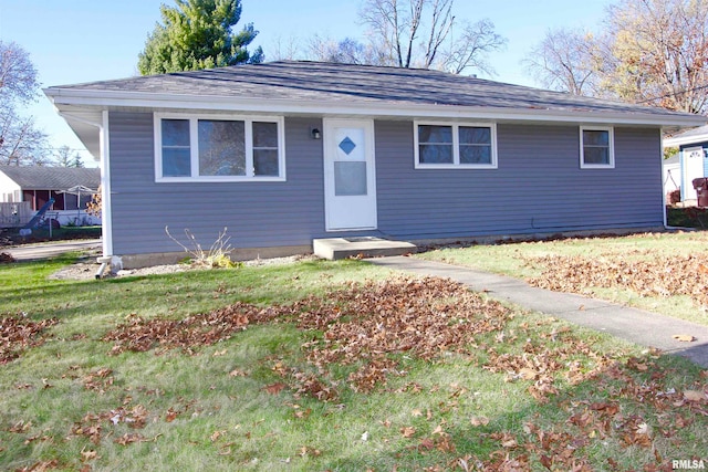 ranch-style home with a front yard