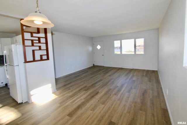 spare room with dark hardwood / wood-style floors