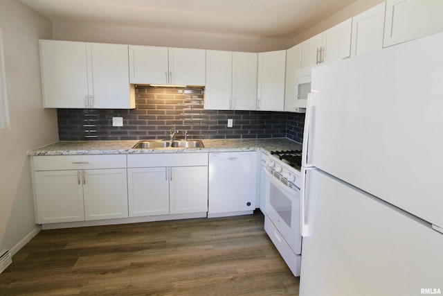 kitchen with white cabinetry, dark hardwood / wood-style flooring, white appliances, and sink