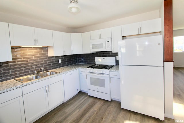 kitchen featuring white cabinets, dark hardwood / wood-style floors, white appliances, and sink