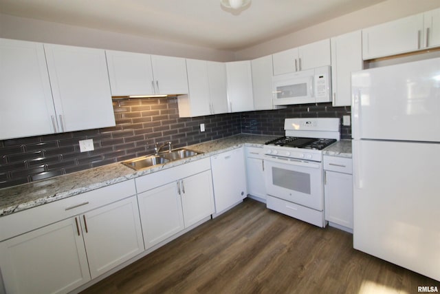 kitchen featuring decorative backsplash, white cabinetry, dark hardwood / wood-style flooring, and white appliances