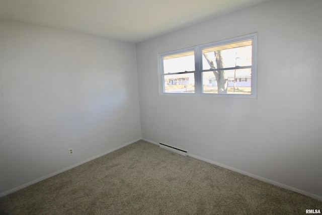 empty room featuring carpet flooring and a baseboard radiator