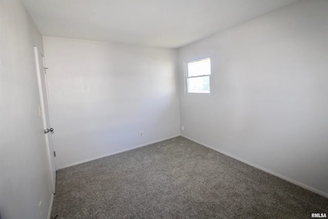 empty room with carpet flooring