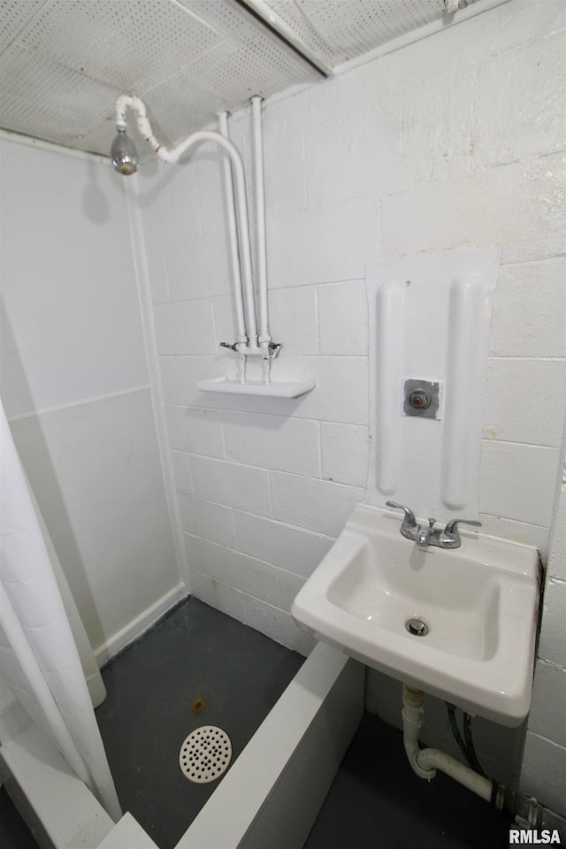 bathroom featuring sink and walk in shower