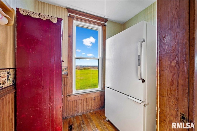 kitchen with wood-type flooring and white fridge