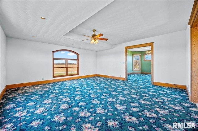 empty room with ceiling fan and carpet flooring