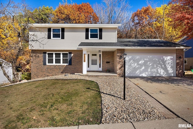 view of front property with a garage and a front lawn