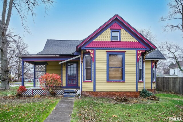 victorian home with a front yard