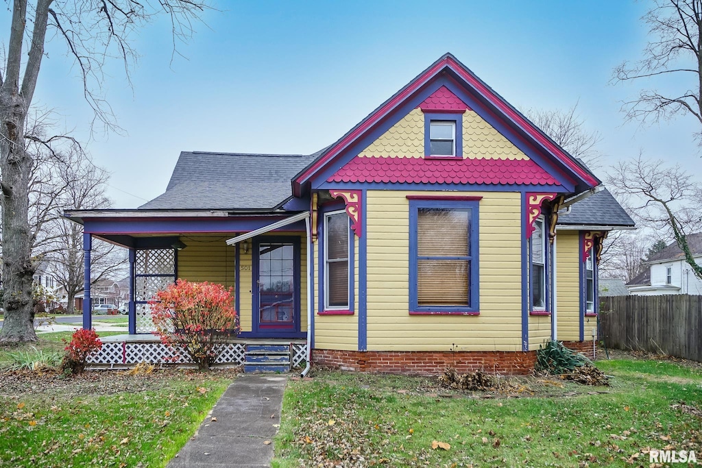 victorian home with a front yard