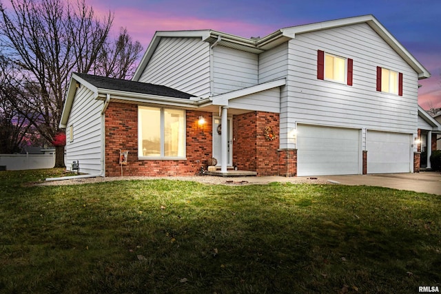 view of front facade featuring a yard and a garage