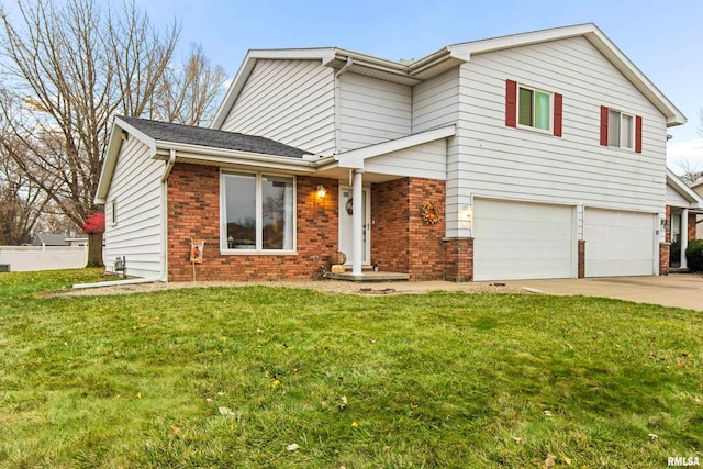 view of front of property with a garage and a front lawn