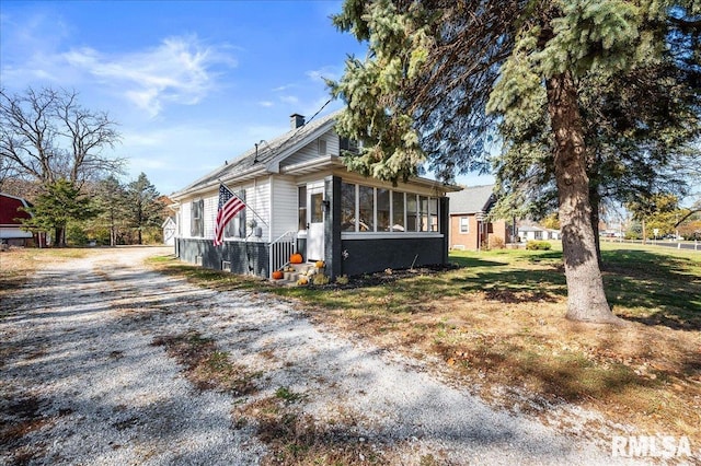 view of front of home with a sunroom