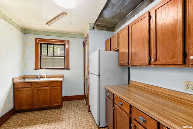 kitchen with white fridge and sink