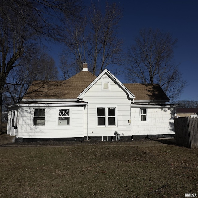 back of house featuring a yard