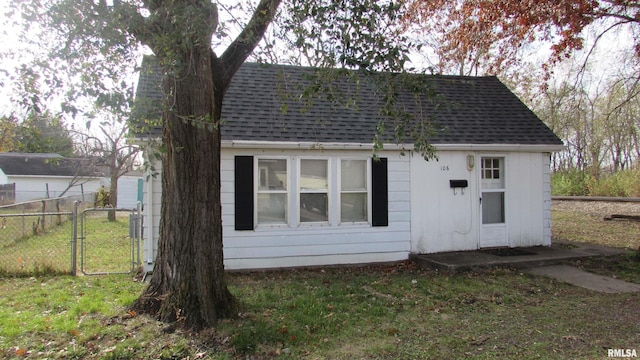 view of outdoor structure featuring a lawn