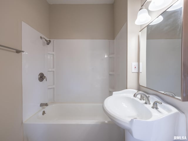 bathroom featuring sink and bathtub / shower combination