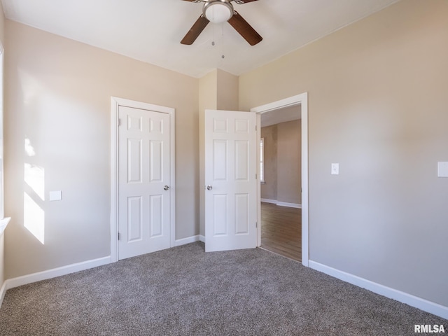 unfurnished bedroom with carpet flooring, ceiling fan, and a closet