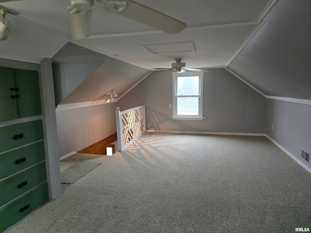 additional living space featuring carpet, ceiling fan, and lofted ceiling