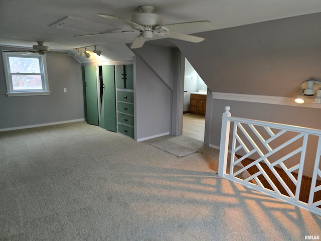 bonus room featuring light colored carpet, ceiling fan, and lofted ceiling