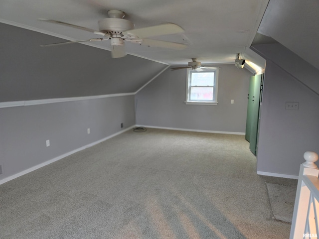 bonus room with light colored carpet, vaulted ceiling, and ceiling fan