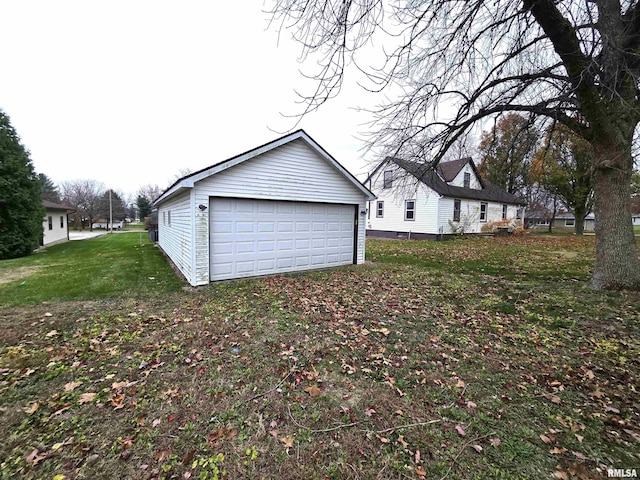 garage featuring a lawn